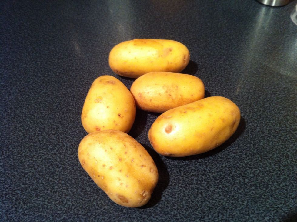 Slice the potatoes fairly thickly, with or without their skins, and boil them until they are soft but before they fall apart. Waxy salad potatoes are great for this dish.