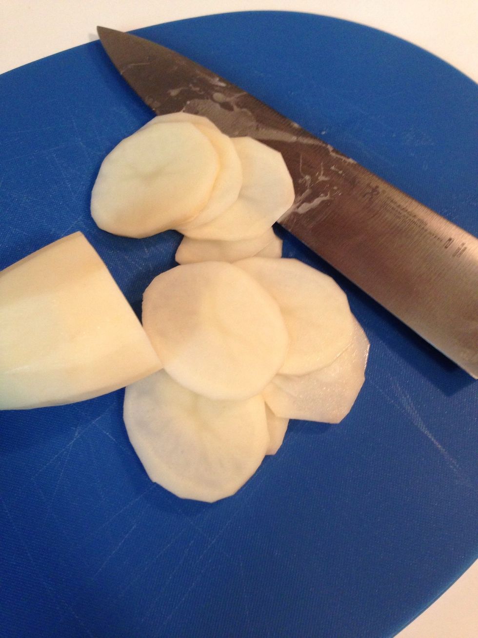 Slice the potatoes very thin. If you have a mandolin slicer, you'll get more uniform chips, but I happen to like the little imperfections you get when doing it by hand.