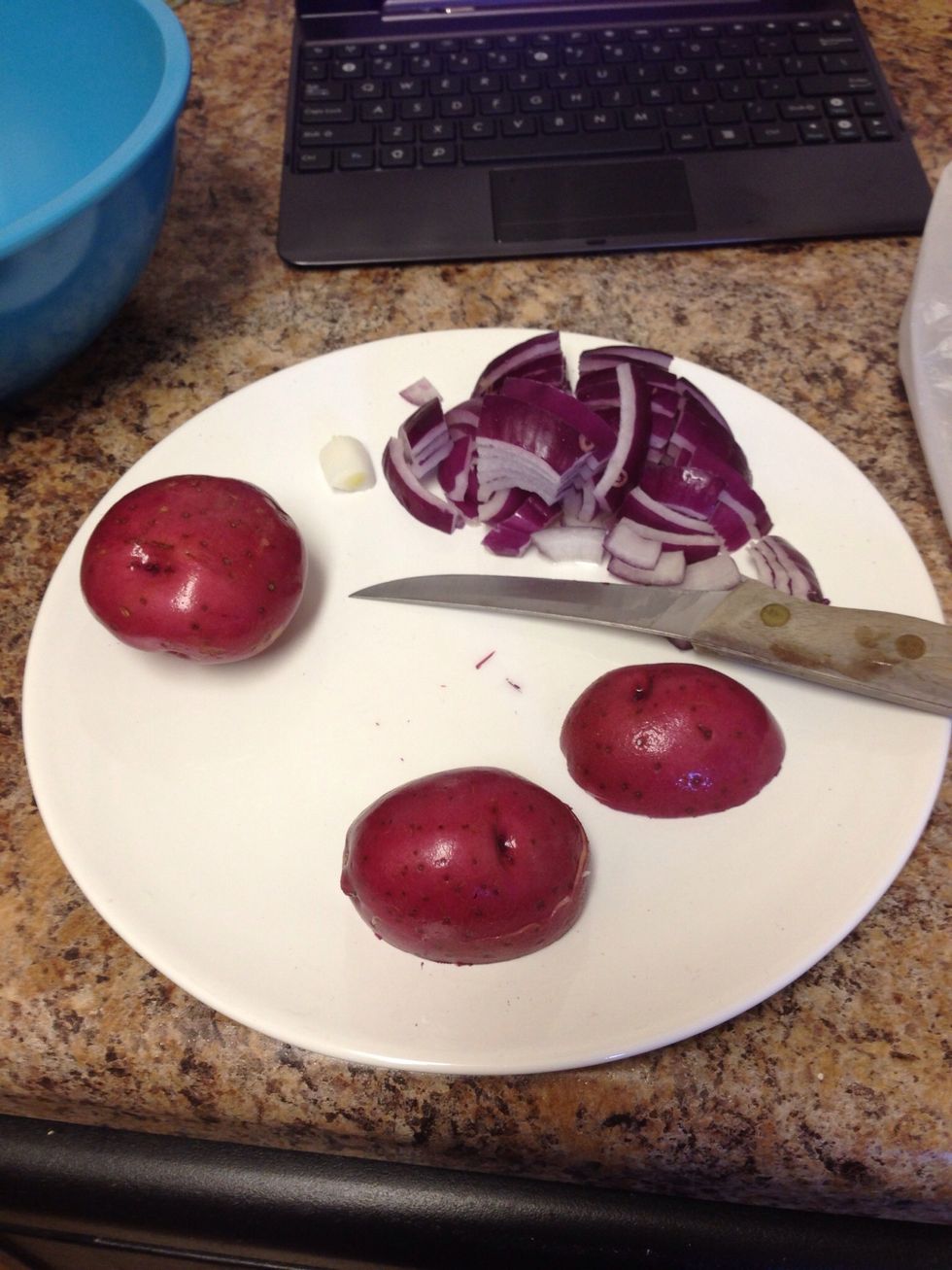 Slice the red onions and red potatoes. I usually cut the potatoes into small cubes.