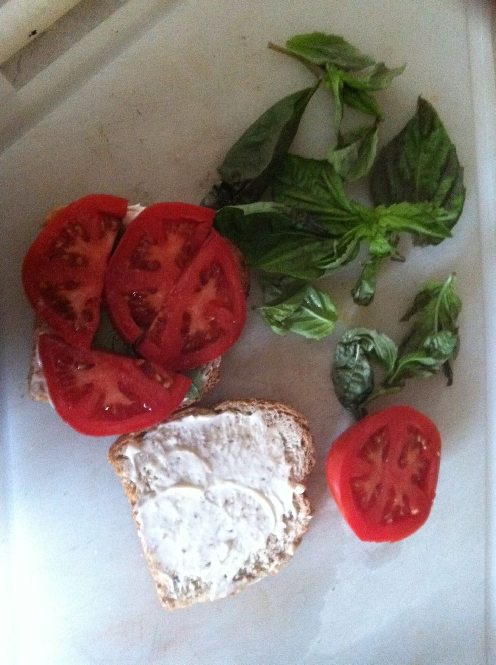 Slice the tomato, spread mayonnaise on your toasted bread, and prep the basil