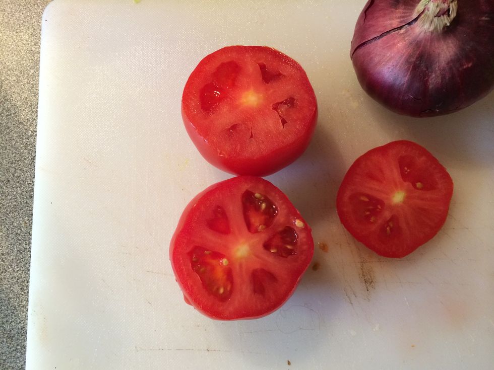Slice the top off of both of the tomatoes.
