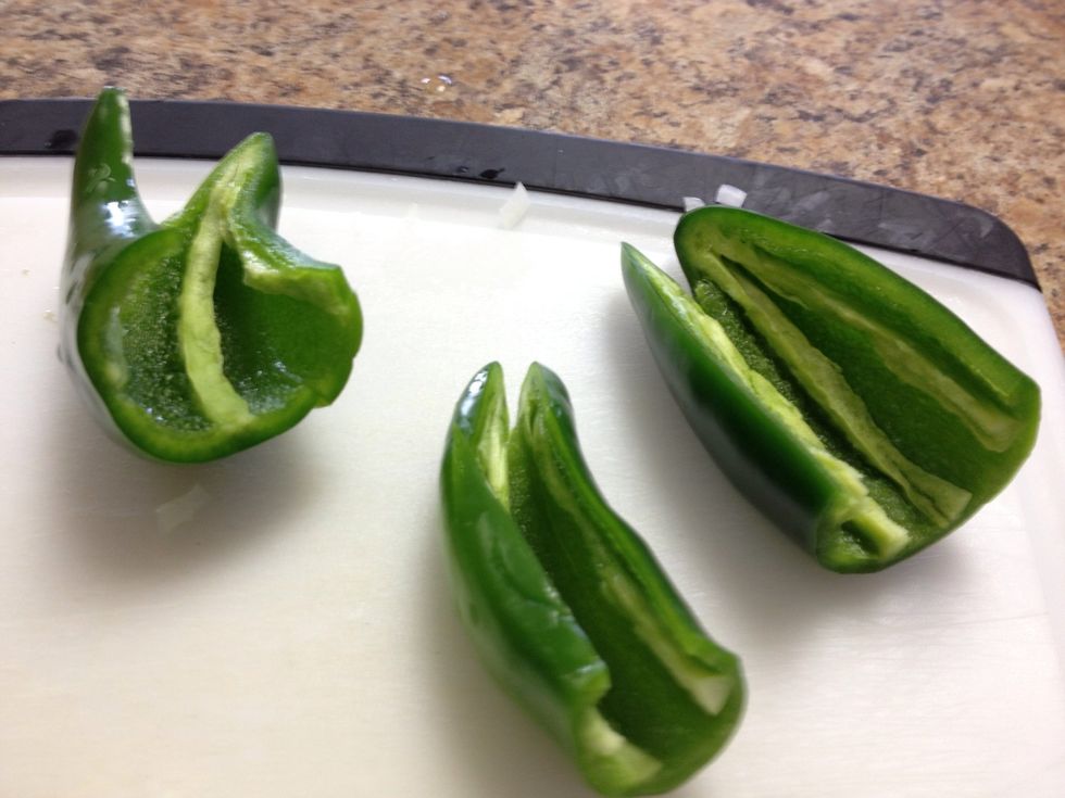 Slice the tops off and devein the jpns. Take care to get all the seeds. This is for flavor not heat. You can add up to 6 without overpowering.