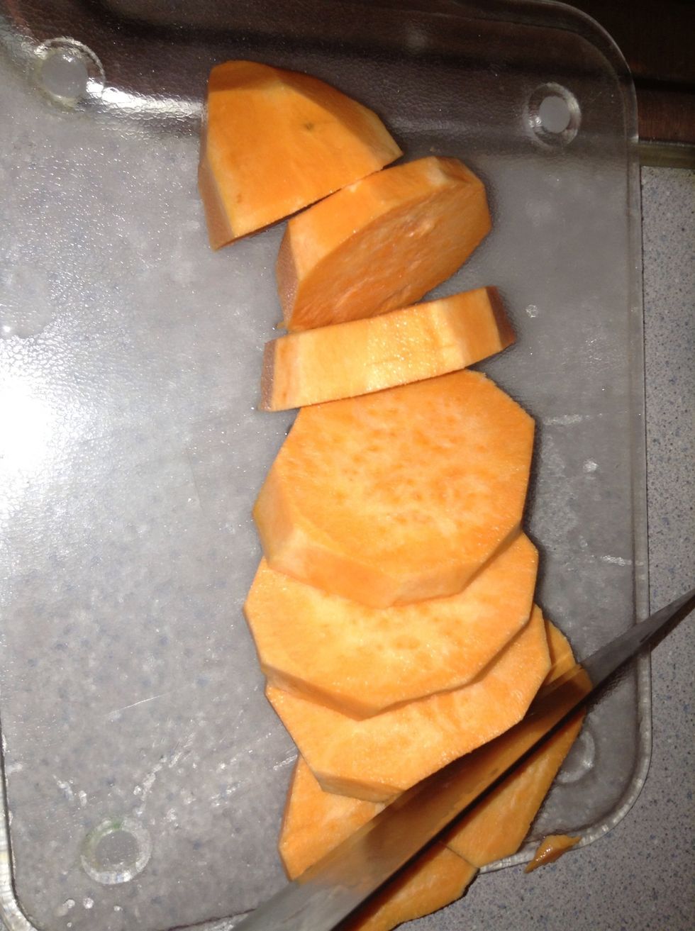 Slice them into smaller pieces. Be careful as sweet potatoes are a little tougher to chop up than apples and red potatoes..