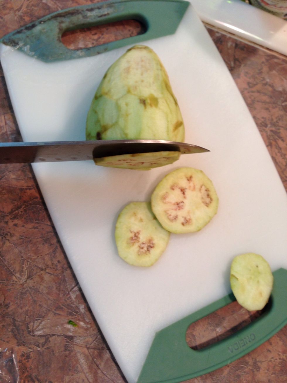 Slice thin. Do not be concerned with the seeds. They are hardly noticed.