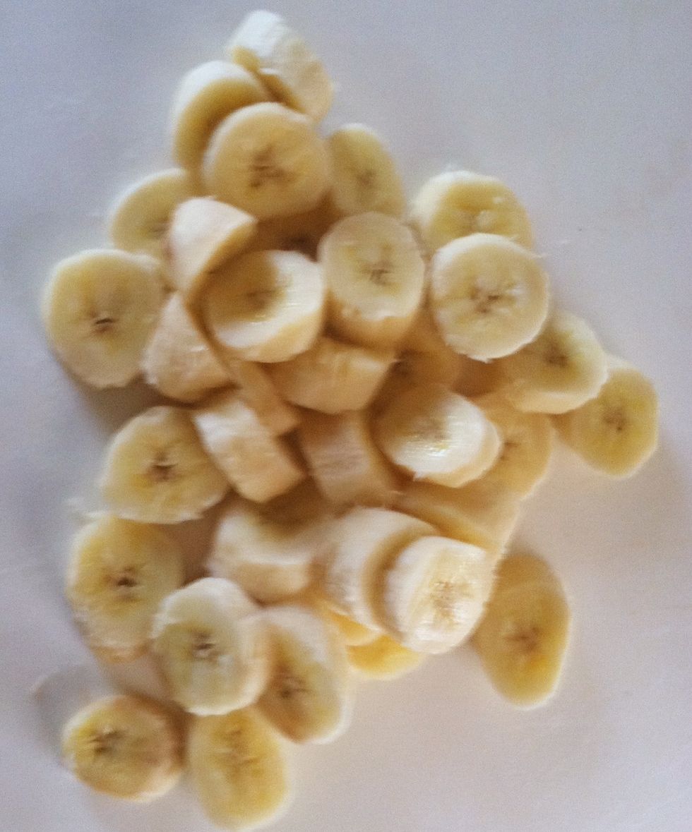 Slice three very ripe bananas.