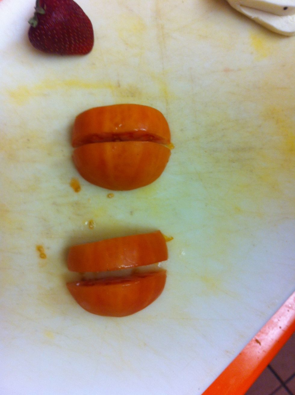 Slice tomato halves in to quarters, as shown.