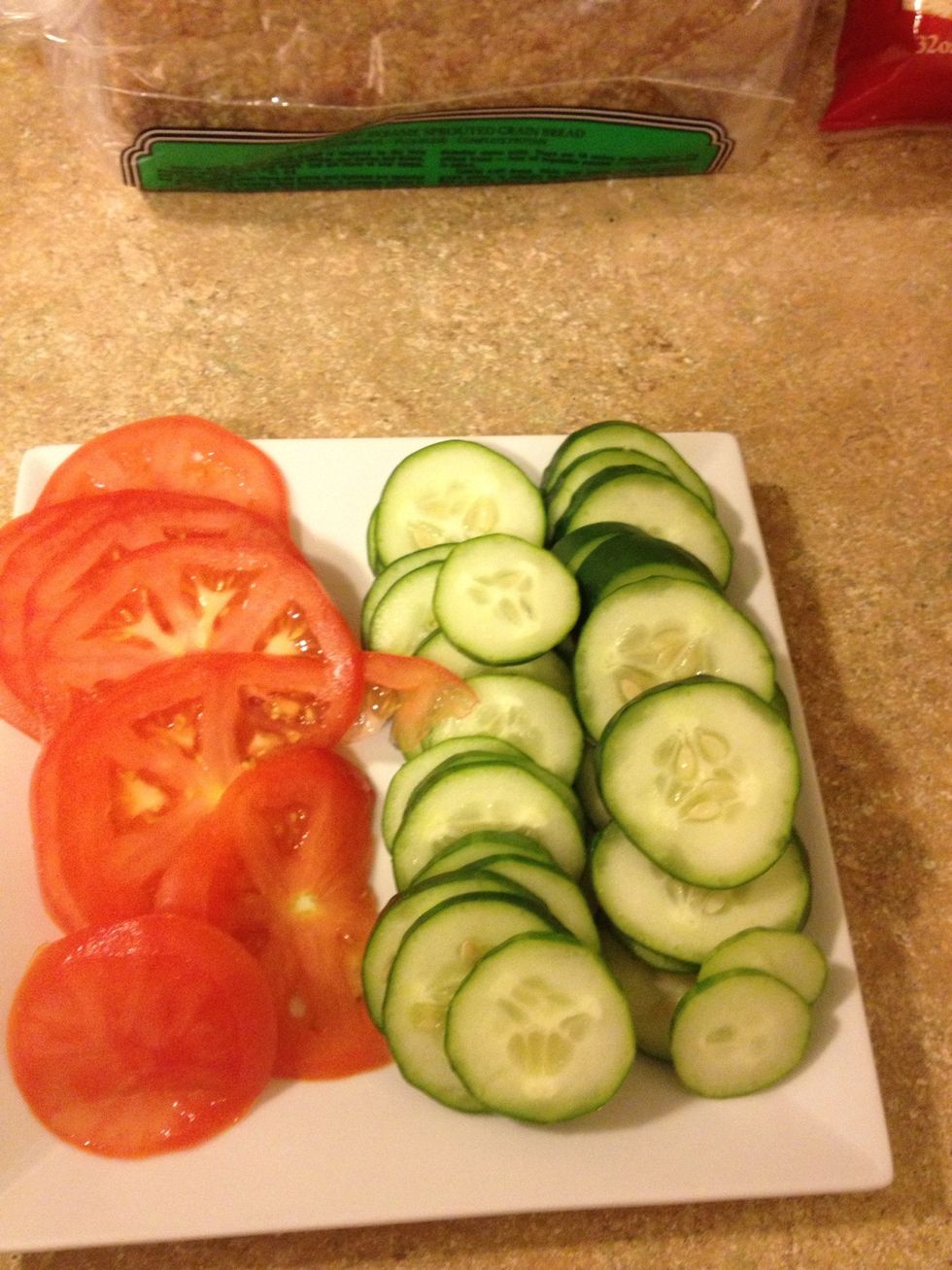 Slice tomatoes and cucumbers