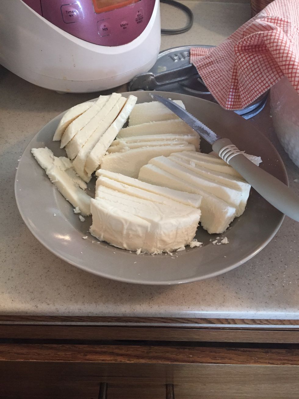 Slice two packs of cheese