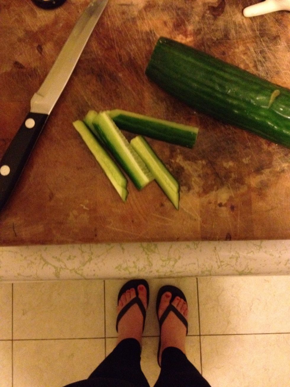 slice up cucumber into thin pieces.
