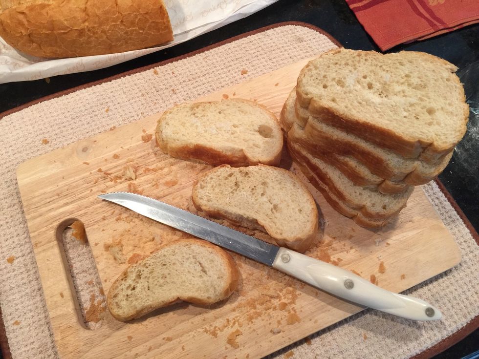 Slice up the bread and then cut into cubes sized pieces.