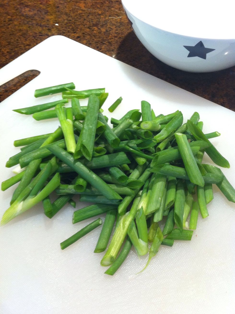 Slice up two bunches of green onions