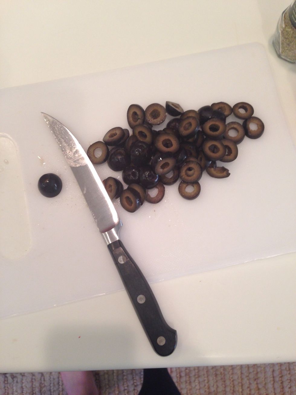 Slice up your olives so they make an O shape. Each olive should make 3 or 4 slices.