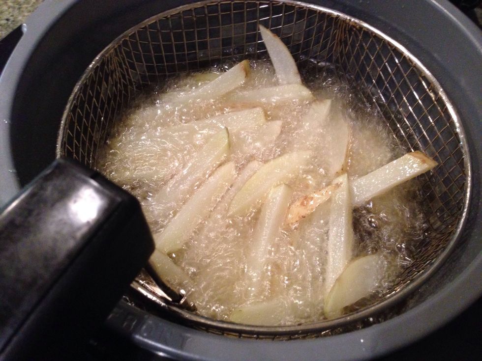 Slice up your potatoes, skin on if you prefer. Fry them in peanut oil or high heat canola oil.