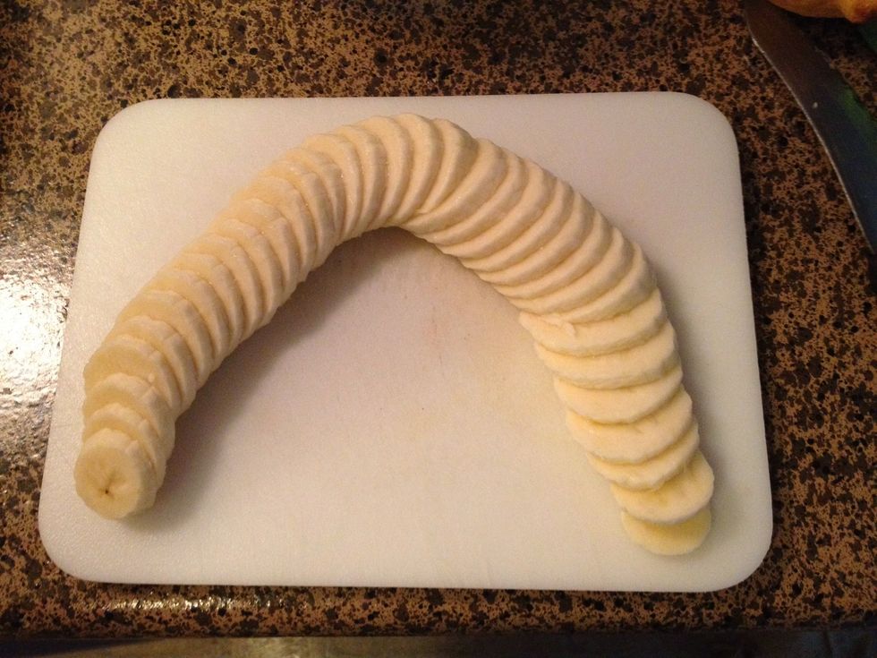 Slice your banana between 1/8th & 1/4 inch thick. Next prep your water to soak the bananas to help prevent too much browning.