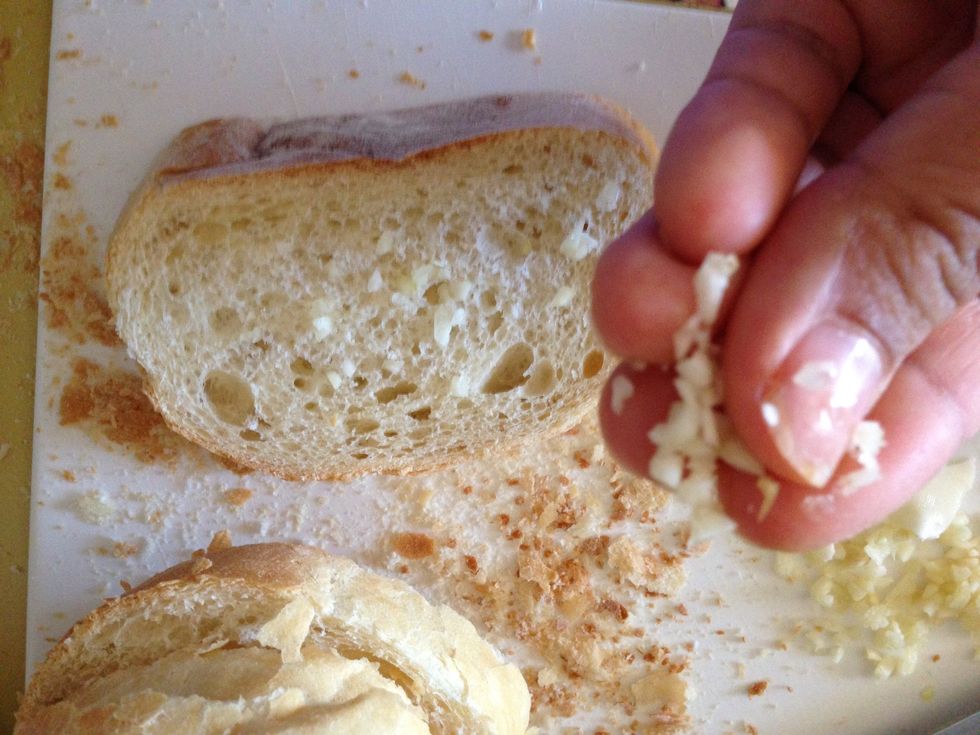 Slice your bread loaf and rub garlic into each bread slice.