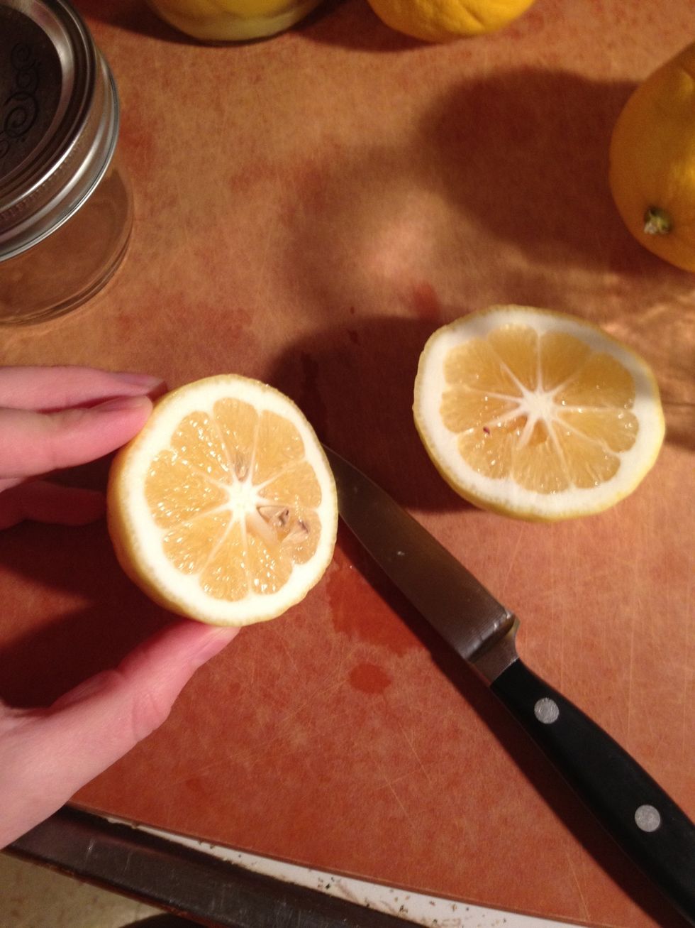 Slice your lemon in half, then slice in half almost but not entirely through the rind, then repeat that cut again so the lemon is quartered, but still in one piece