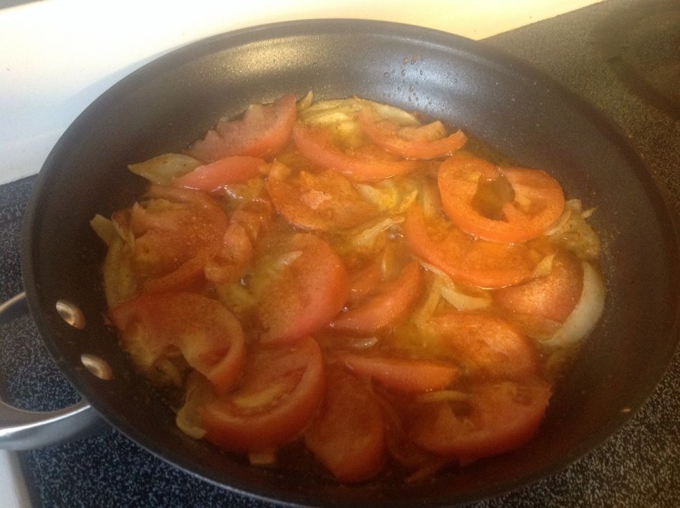 Slice your tomato(s), I like a lot, and stir allowing them to get a little soft. I like to add more adobo and hot pepper at this point but if you prefer it milder, skip this.