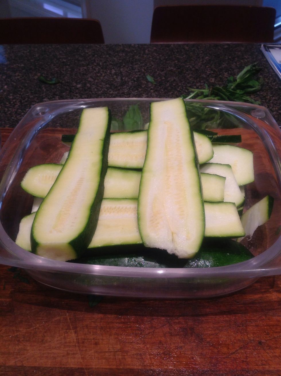 Slice zucchini lengthways, 8mm thick. Transfer to bowl. Add salt (to drain moisture).