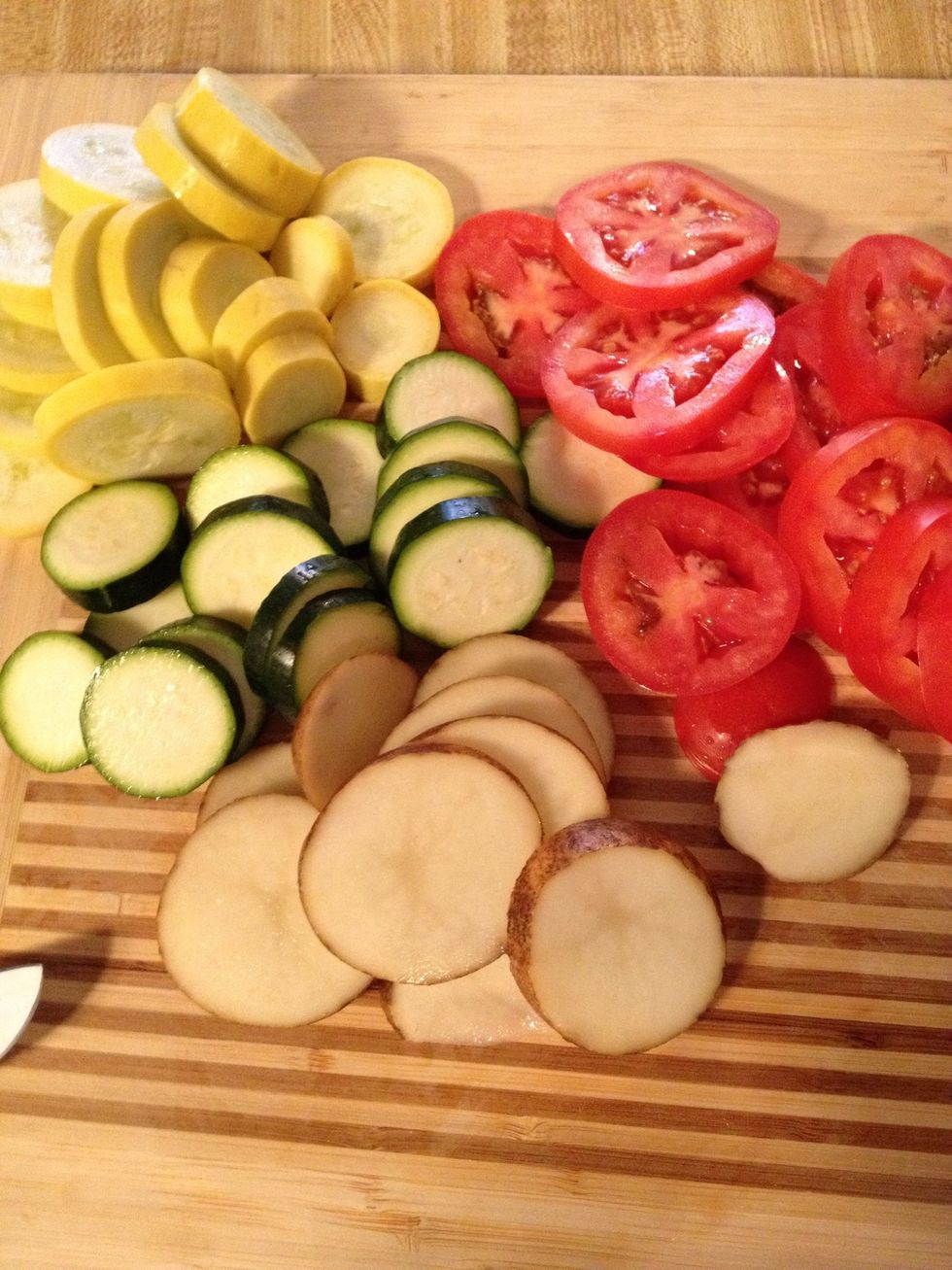 Slice zucchini, squash, potato, tomato, into thin slices