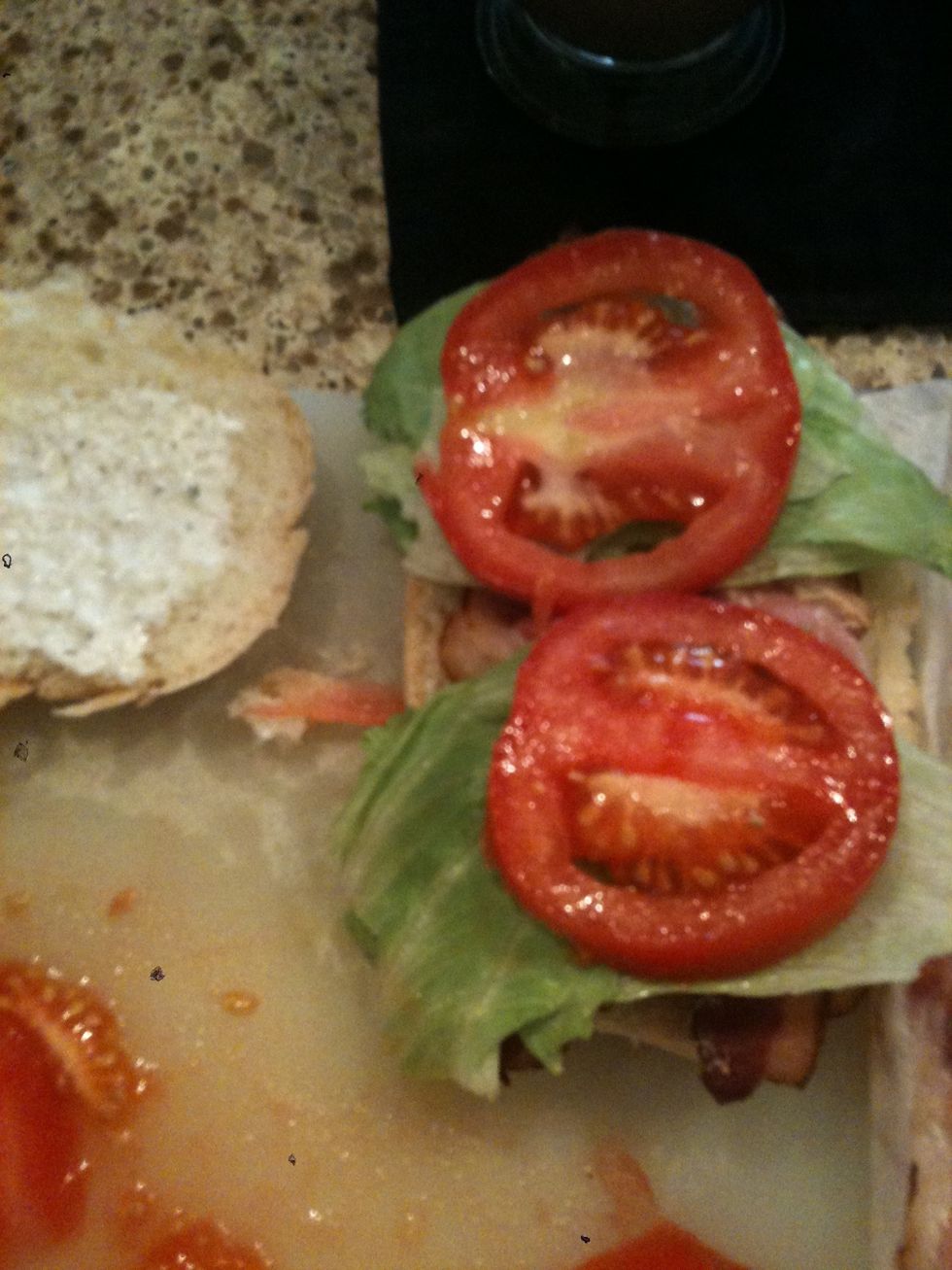 Slices of tomato go right on top of the lettuce