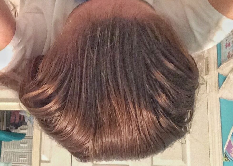 Slick back your hair with water.