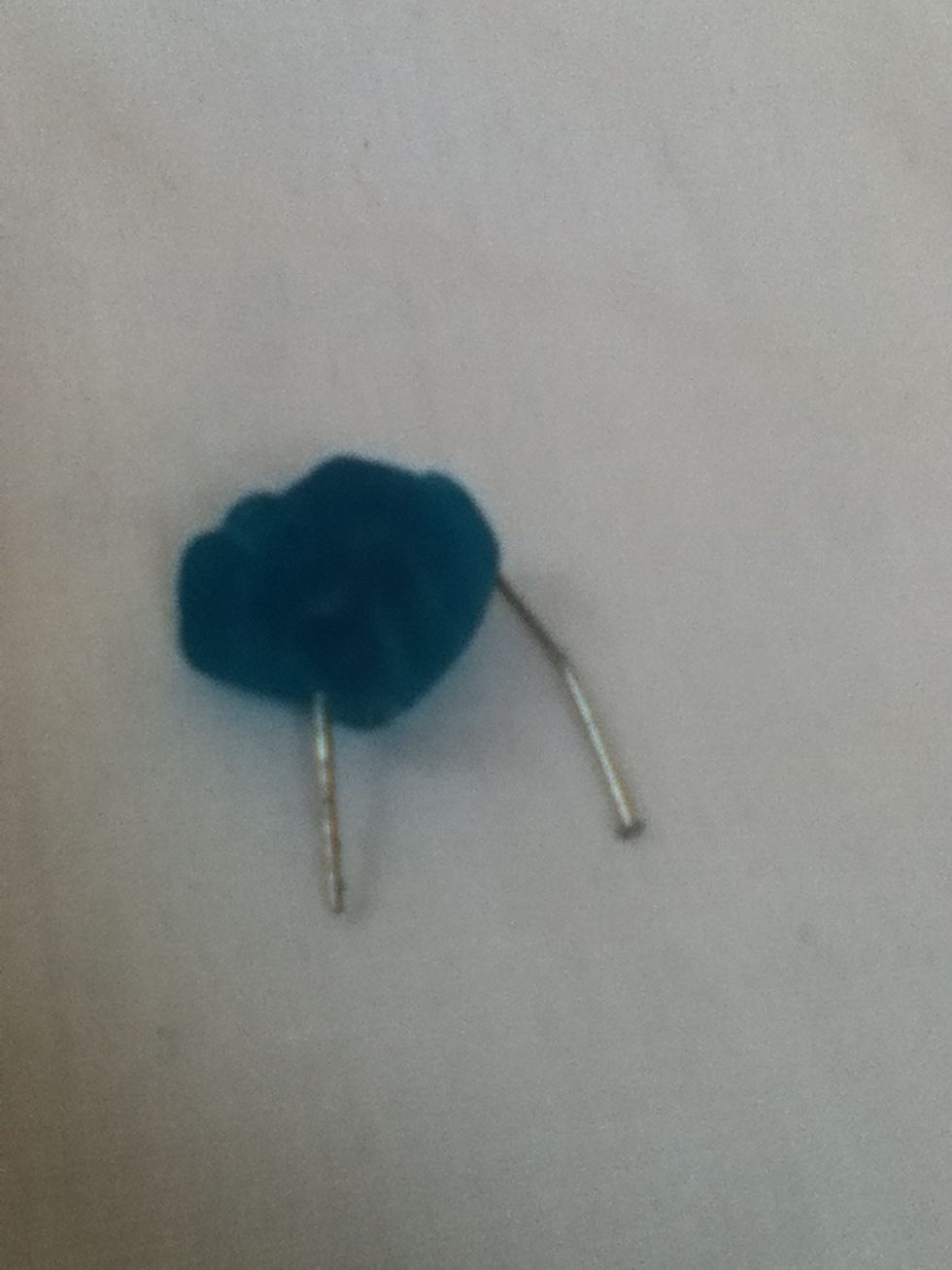 Slide a gummy bear onto an earring hook.Repeat with the other one . People these are not twisted nails. You guys can't even look at anything without saying something's wrong with it.