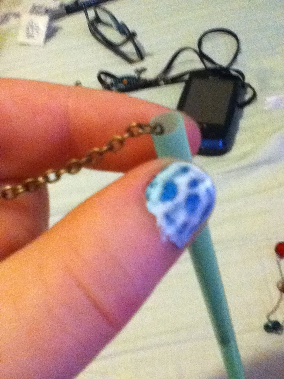 Slide chain of necklace through straw.