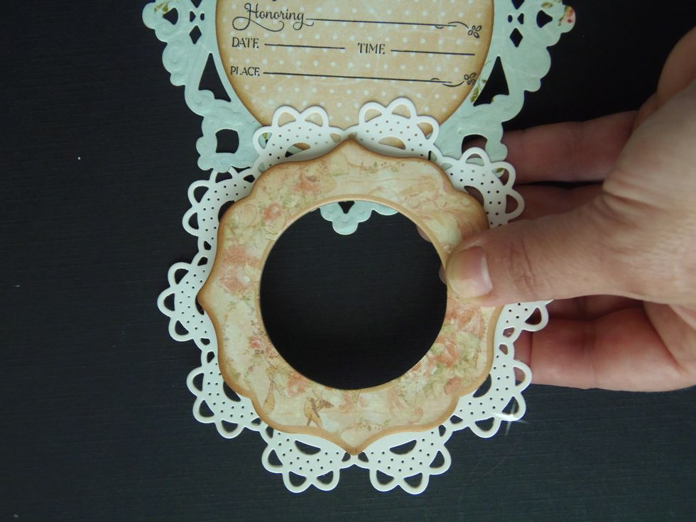 Slide down doily and chipboard frame together making sure they stay centered.