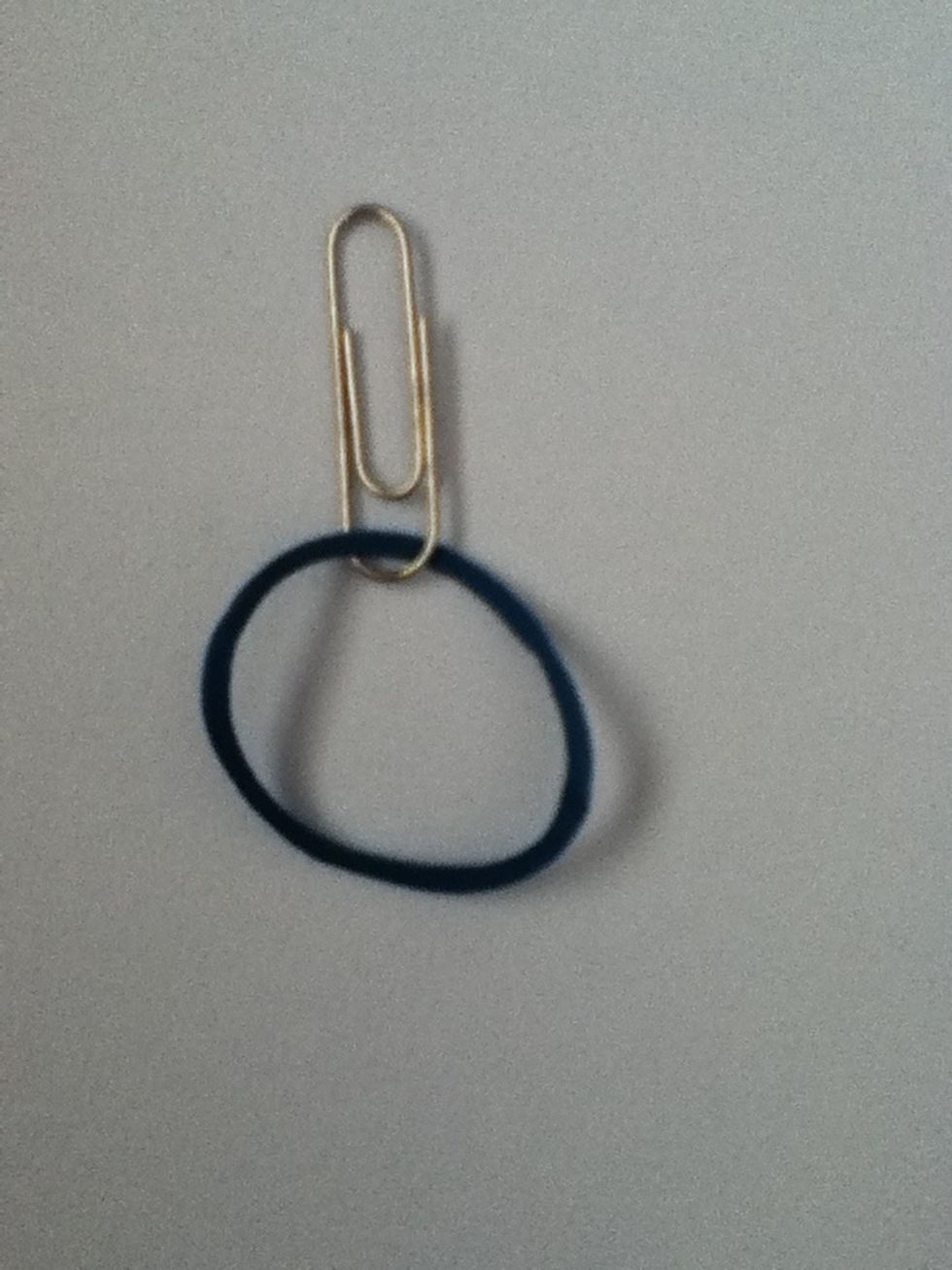 Slide it down to the bottom of the paper clip like so.