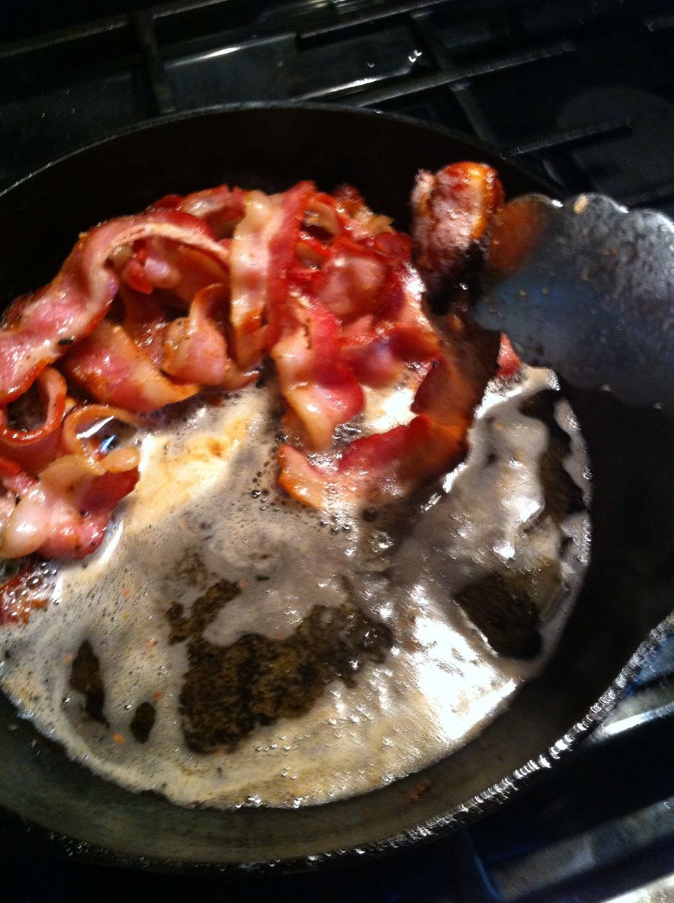 Slide pan to side of flame. Scoot bacon to that side.  Pull out slices to finish browning. See how this slice is almost done?