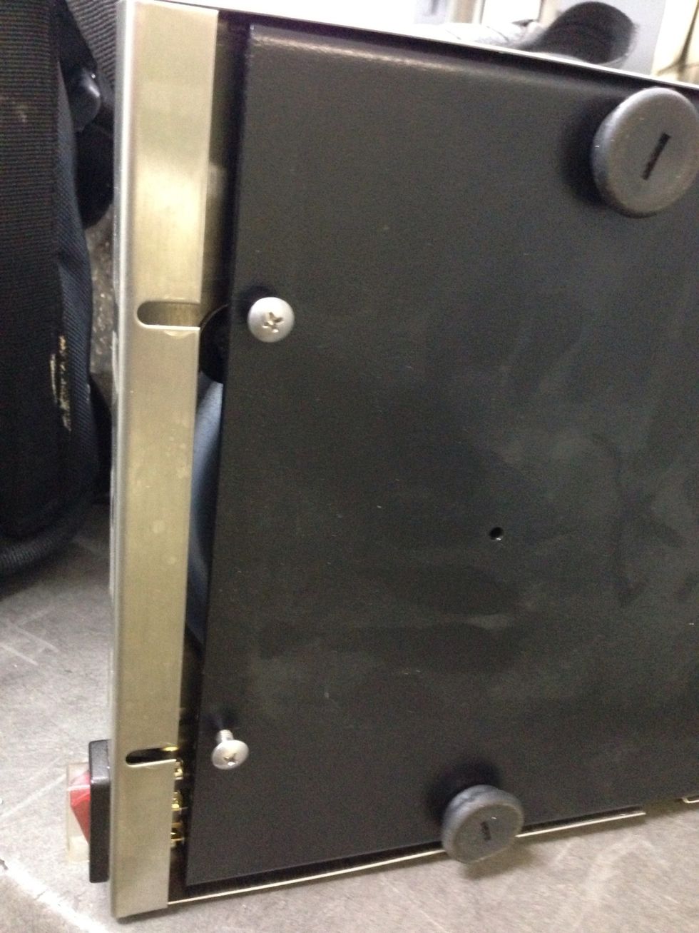 Slide stainless steel panel forward away from the screws