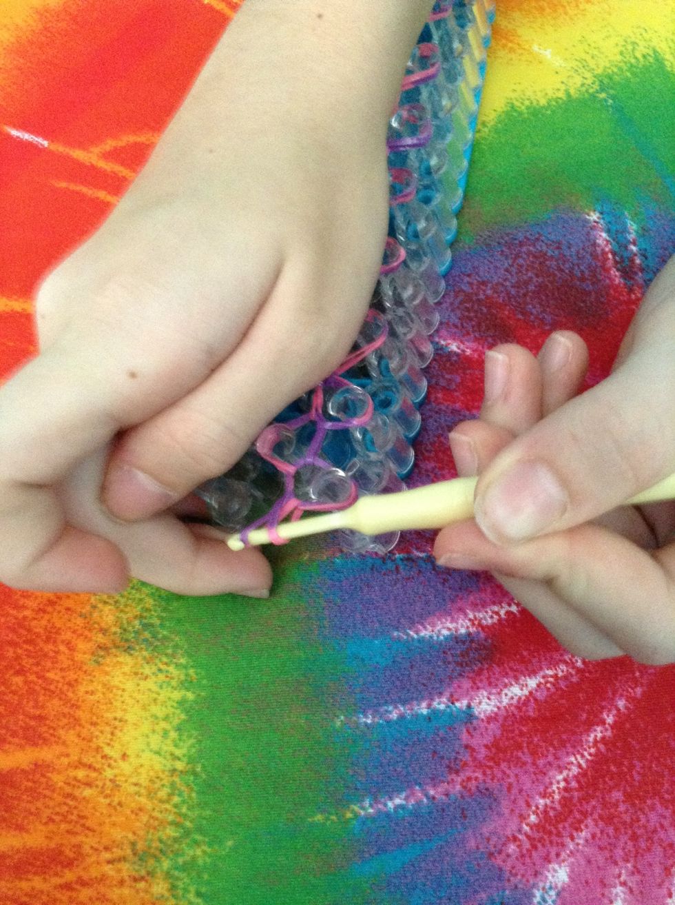 slide the band through and put one part over the other..