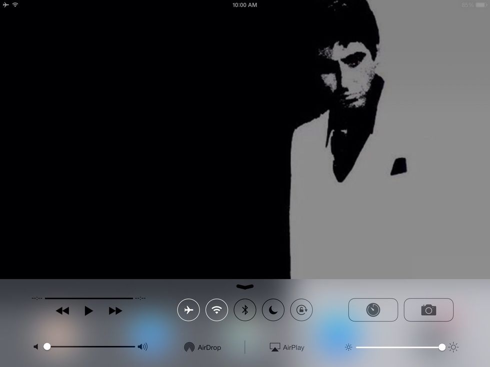 Slide the bottom of the screen and this little box should pop up. There will be a picture of a camera click on that.