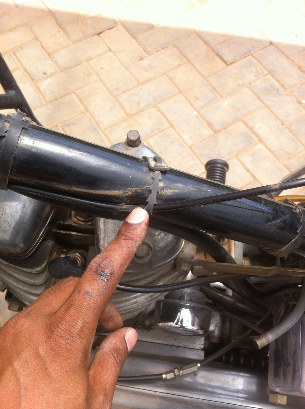 Slide the cable out through the last cable holder.