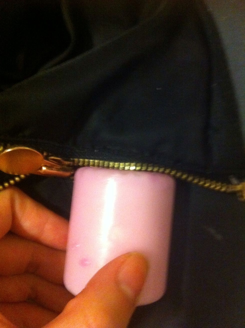 Slide the candle to the zipper. Like this \ud83d\udc46