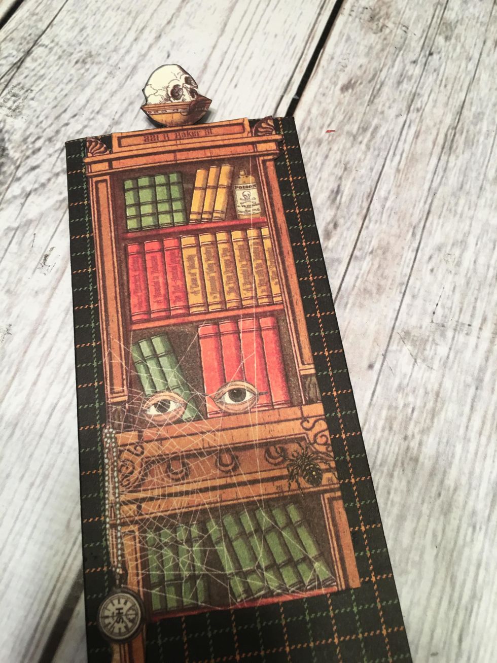 Slide the card into the slider piece with just the skull sticking out.