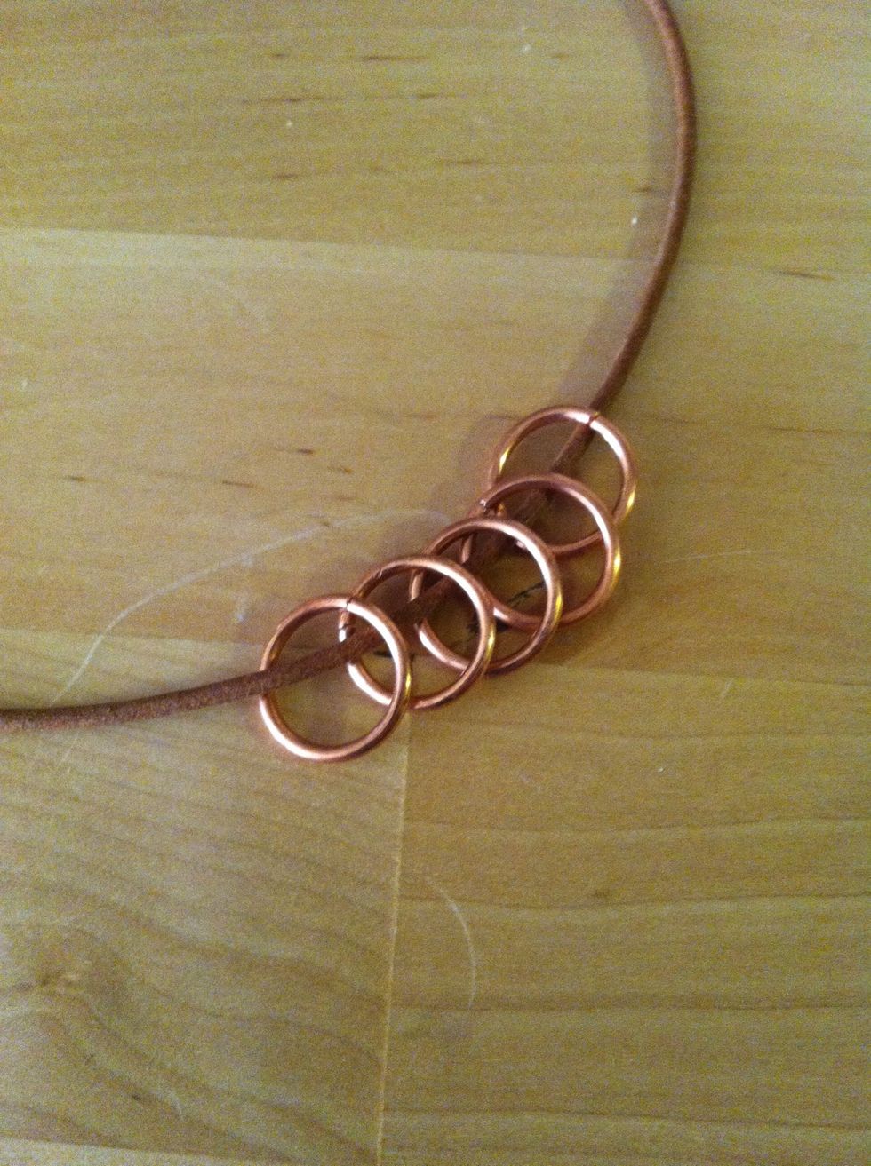 Slide the jump rings on the cord. (Or use a pendant of your choice.)