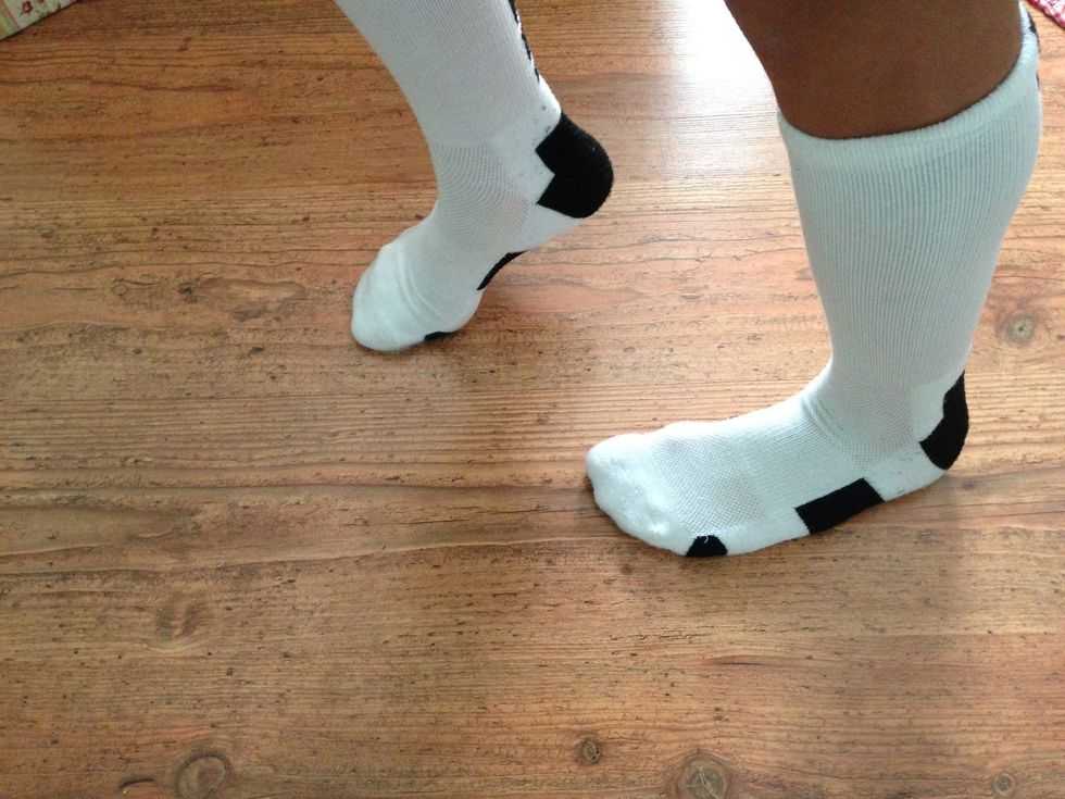 Slide the left foot back keeping the right foot in the same spot