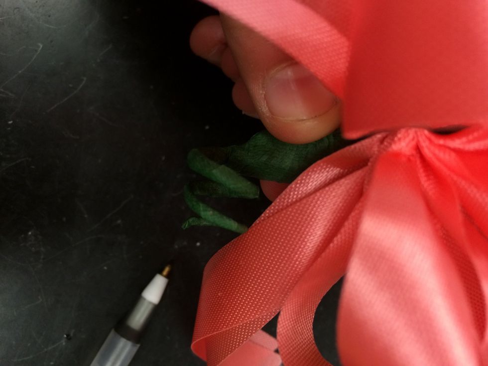 slide the pen out and you should see the wire curled up at the bottom.