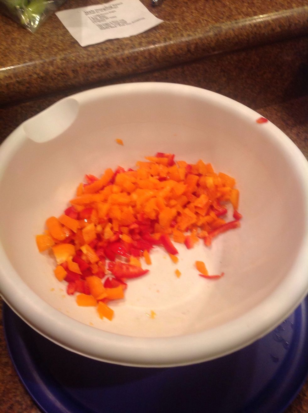 Slide the peppers off the cutting board into the bowl.