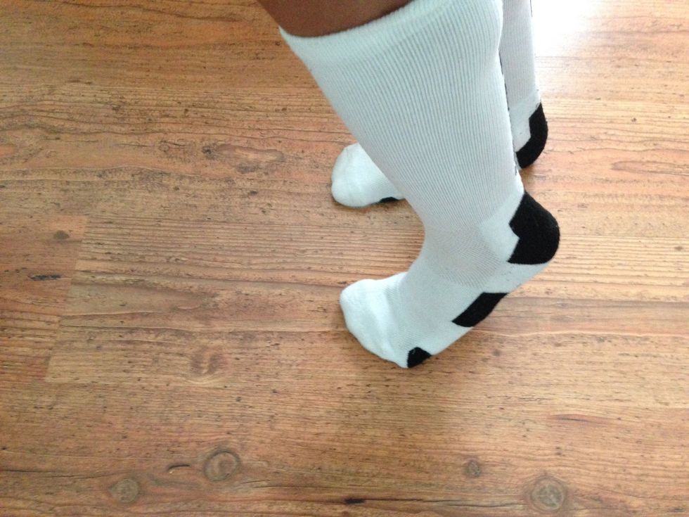 Slide the right foot back parallel with the left foot