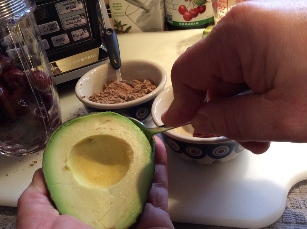 Slide the spoon under the fruit and between the shell.
