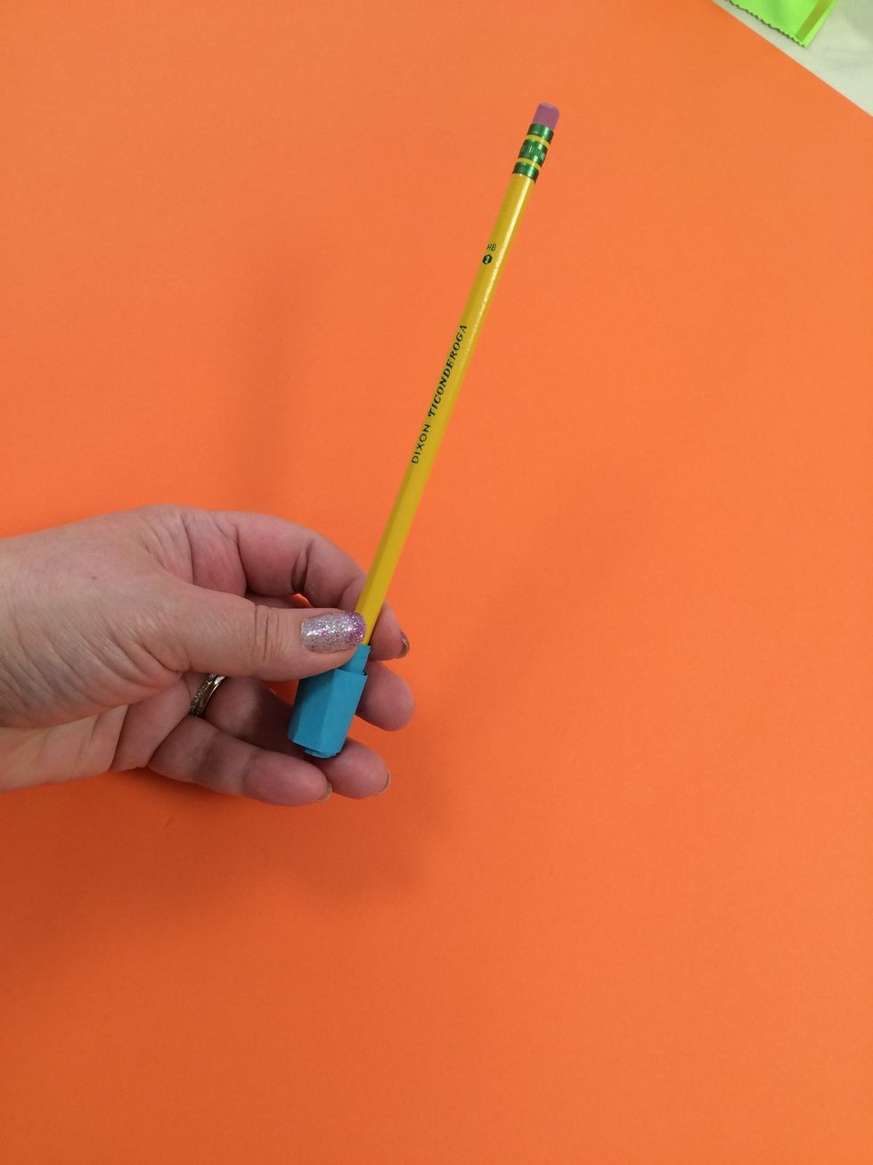 Slide the strip off the pencil.