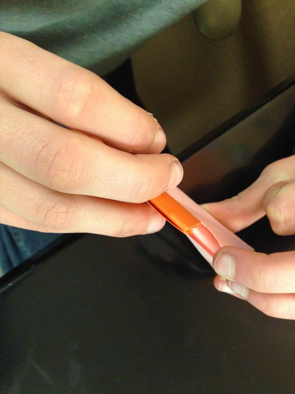 slide the two flaps into the slit in the back of another one.