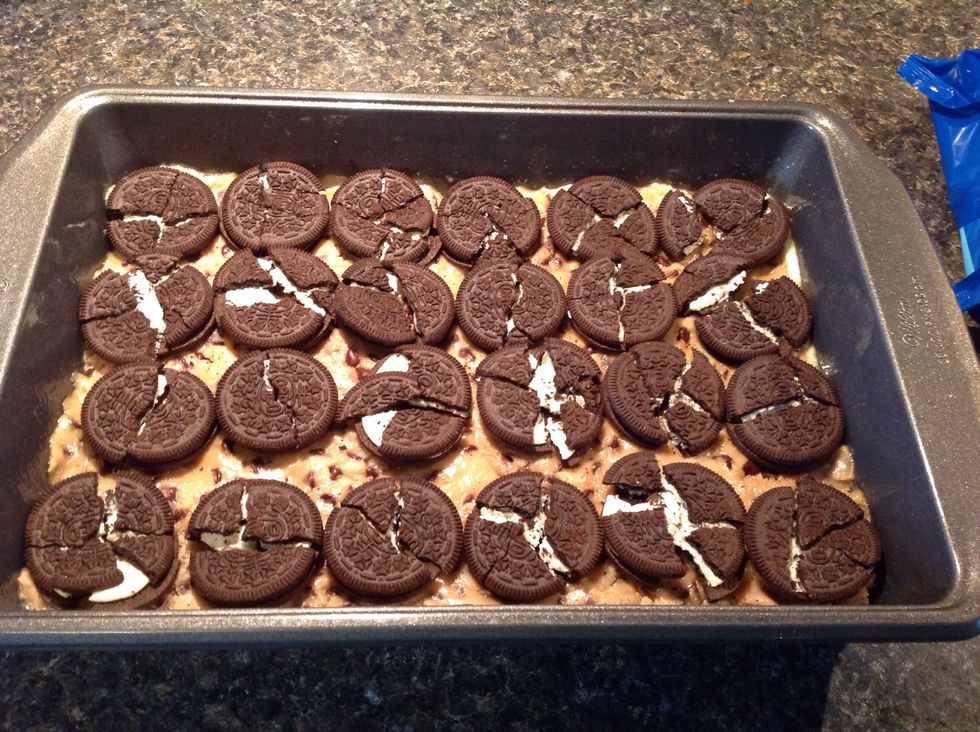 Slightly crumble your Oreos and gently press them into your cookie dough. You may not use them all.
