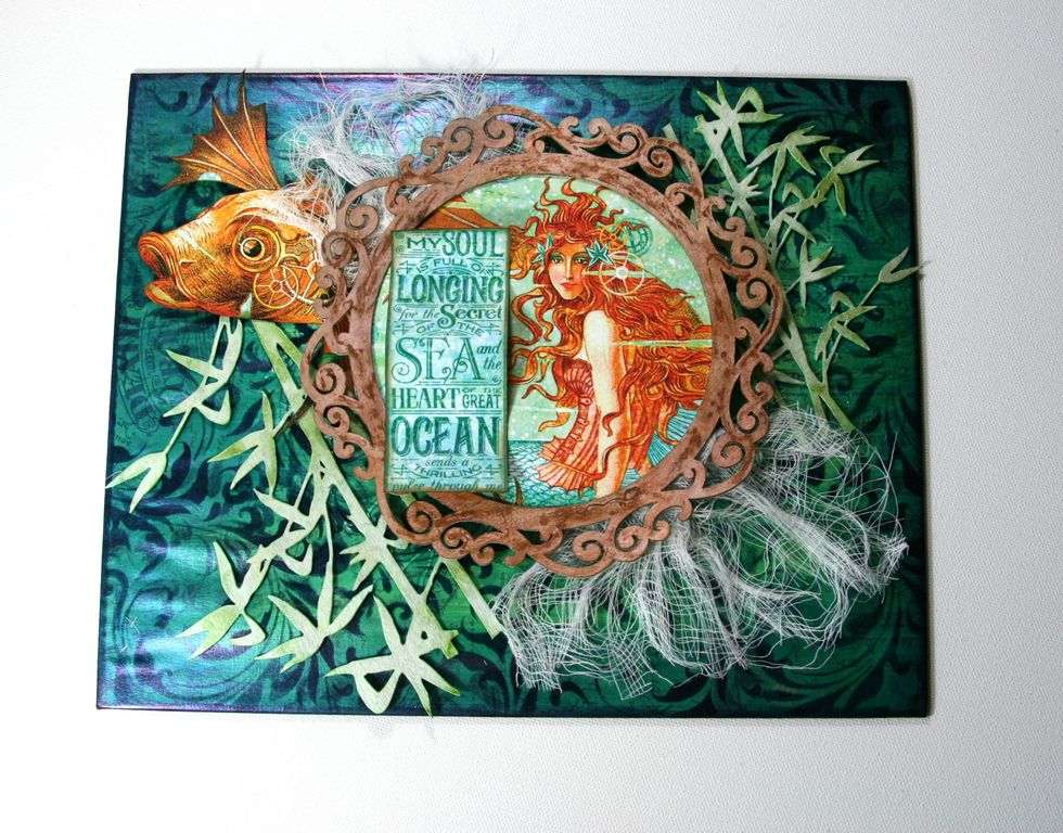 Slightly pull edges of cheesecloth to tatter and secure under Flourish Frame.