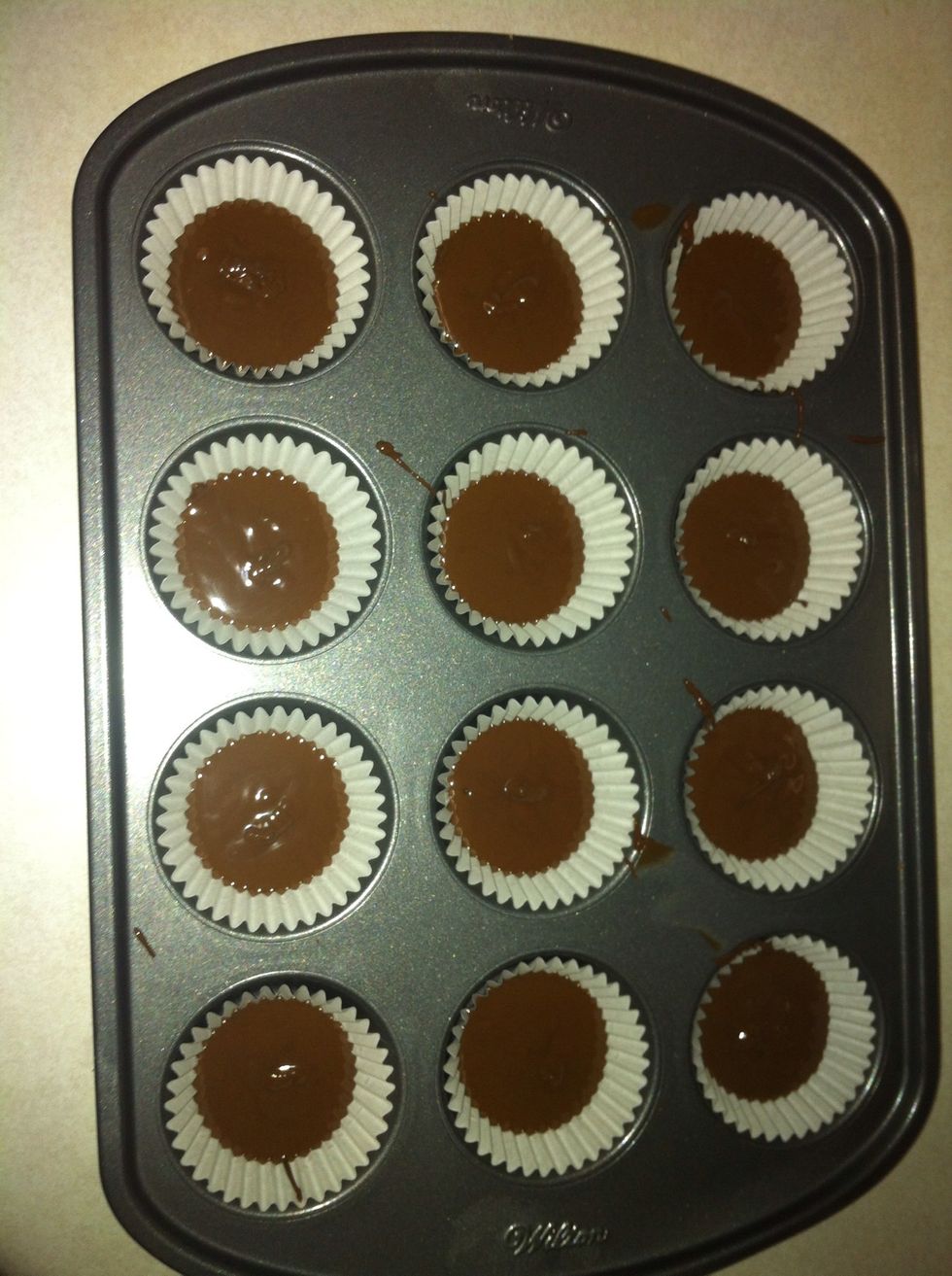 Slightly shake the tray to even out the chocolate. Place in the fridge for 30 minutes to harden.