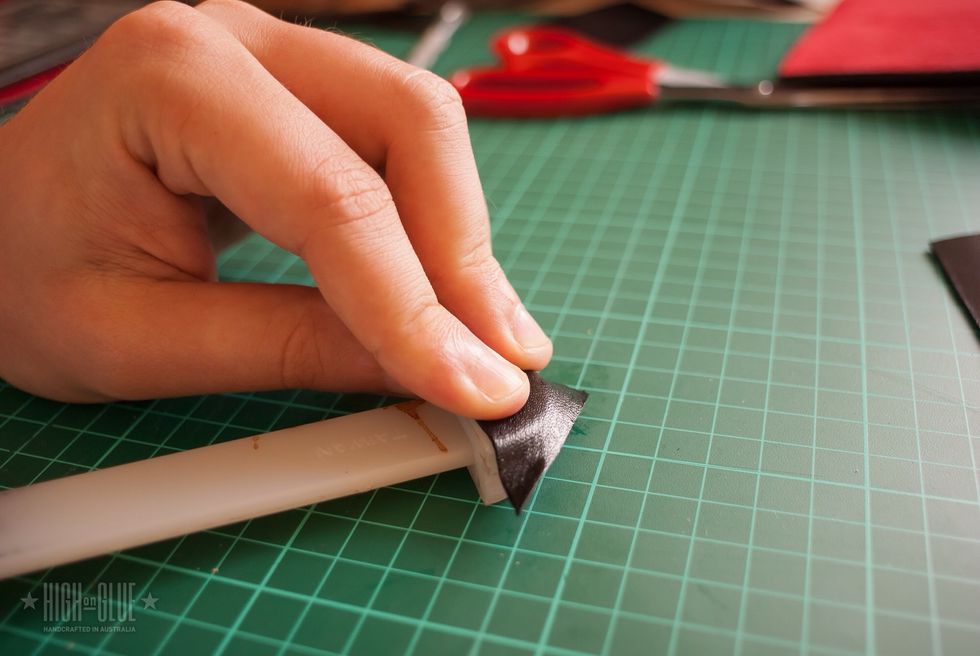 Slightly stretch them into shape using a bone folder (or bottle cap or similar)