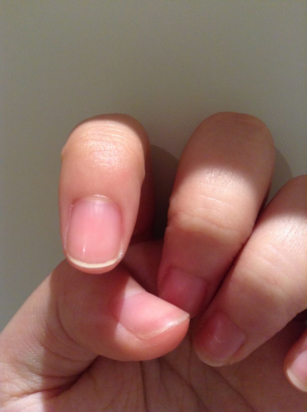 Slightly wet the tip of the nail pencil and draw under you nail. Use a wet tissue to clean up. If you nails are long enough this will result in a neat French manicure.