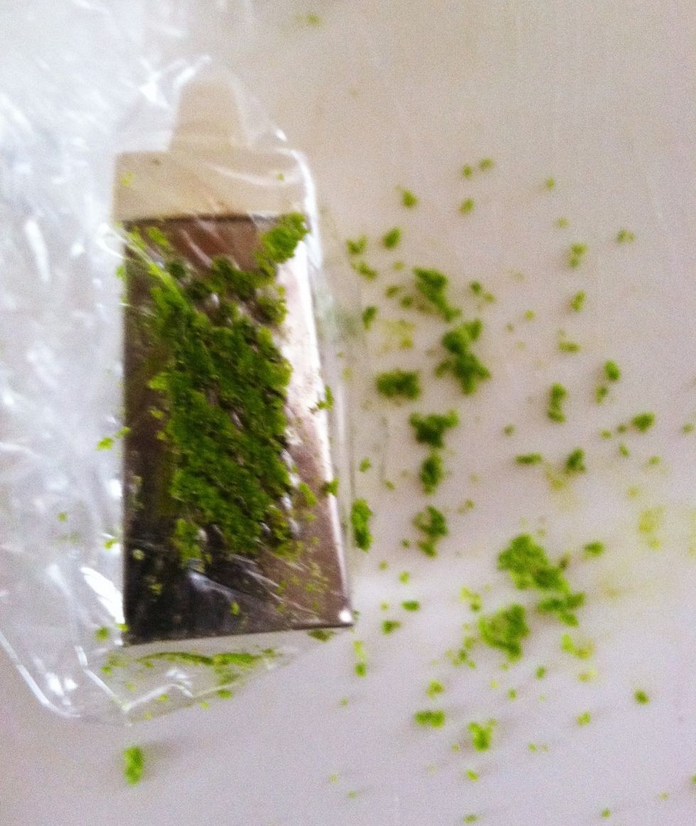 Slip a plastic sandwich bag over a box grater.